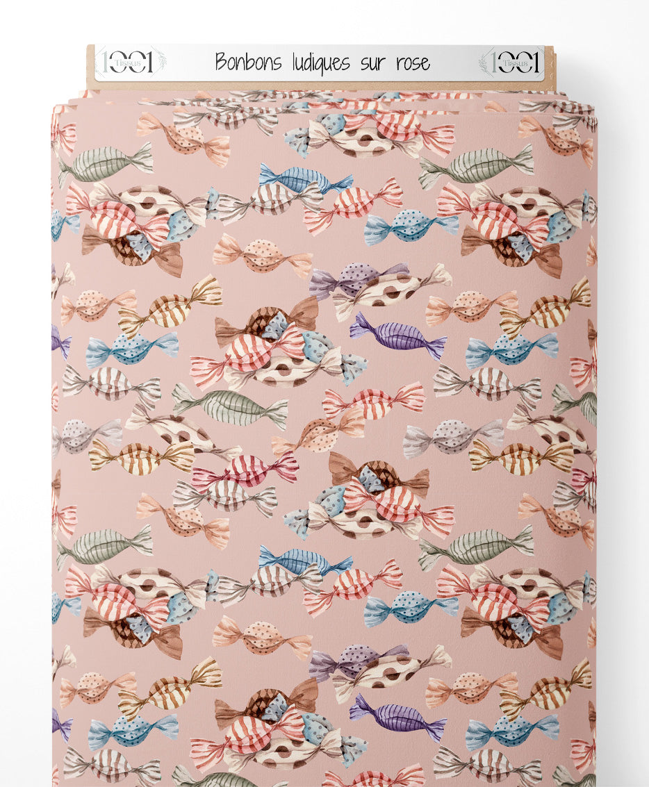 Tissu - Bonbons ludiques sur rose