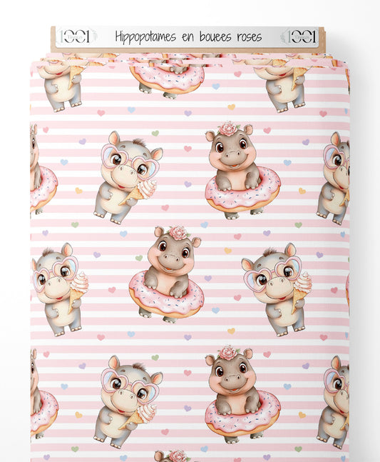 Tissu - Hippopotames en bouées roses