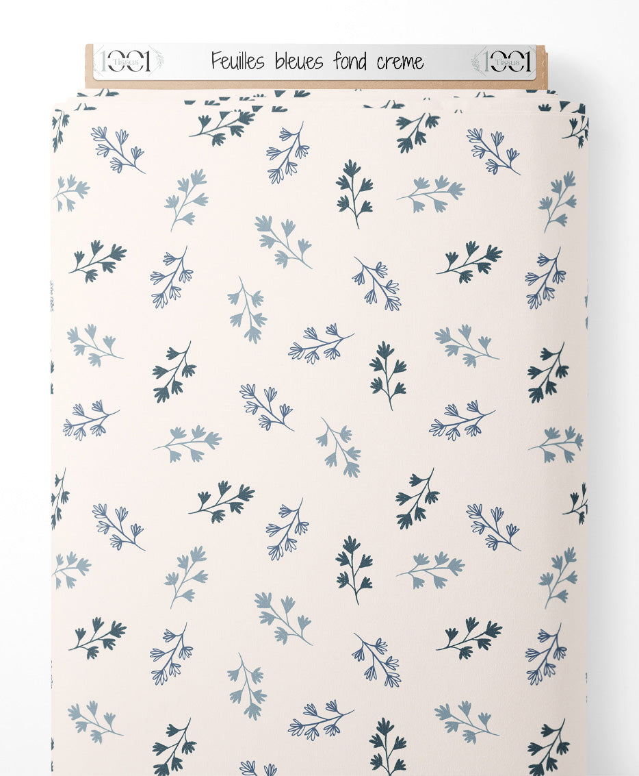 Tissu - Feuilles bleues sur fond crème