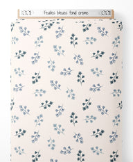 Tissu - Feuilles bleues sur fond crème