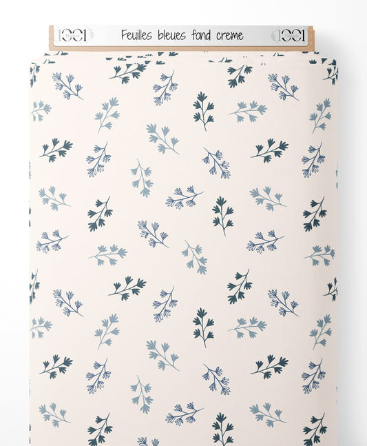 Tissu - Feuilles bleues sur fond crème
