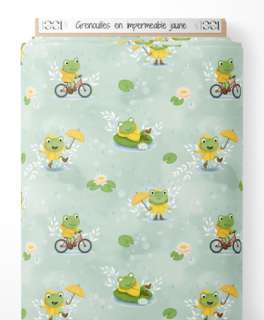 Tissu - Grenouilles en imperméable jaune