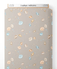 Tissu - Coquillages multicolores sur fond