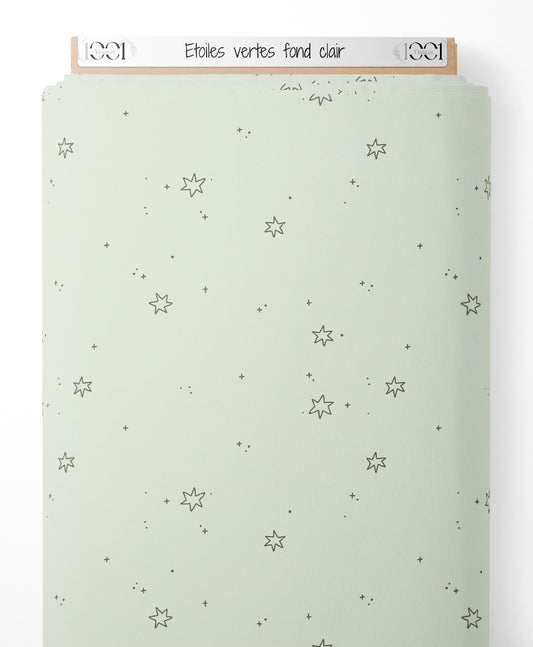 Tissu - Étoiles vertes sur fond clair
