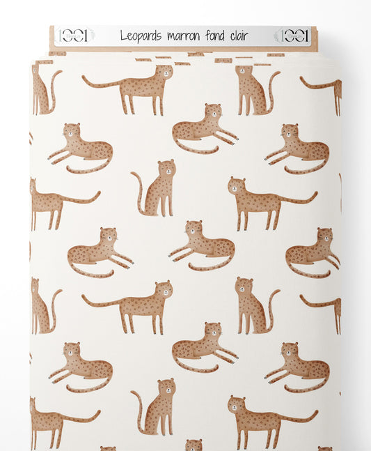 Tissu - Léopards marron sur fond clair