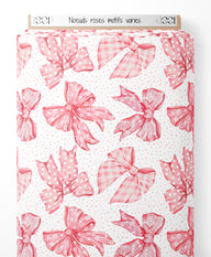 Tissu - Nœuds roses motifs variés