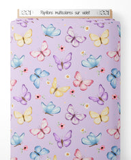 Tissu - Papillons multicolores sur violet