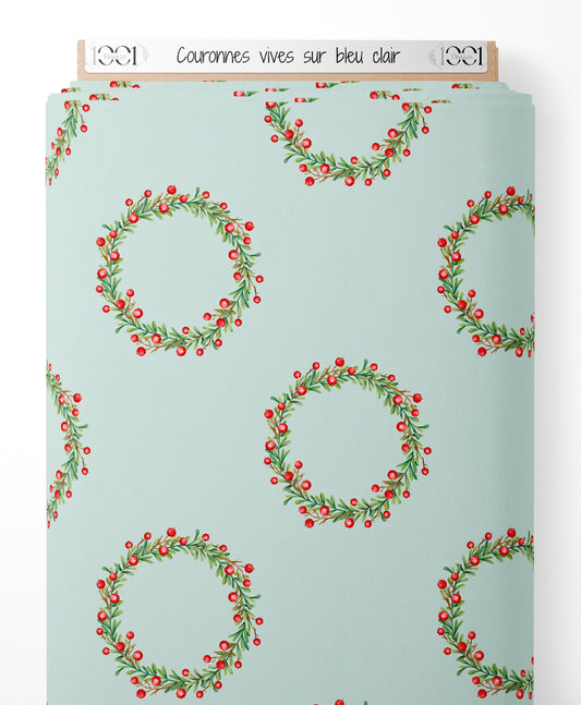 Tissu - Couronnes vives sur bleu clair