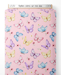 Tissu - Papillons colorés sur rose doux