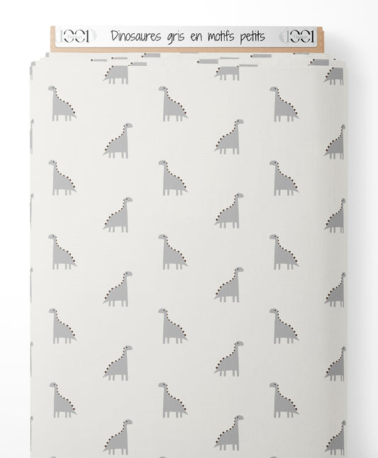 Tissu - Dinosaures gris en motifs petits