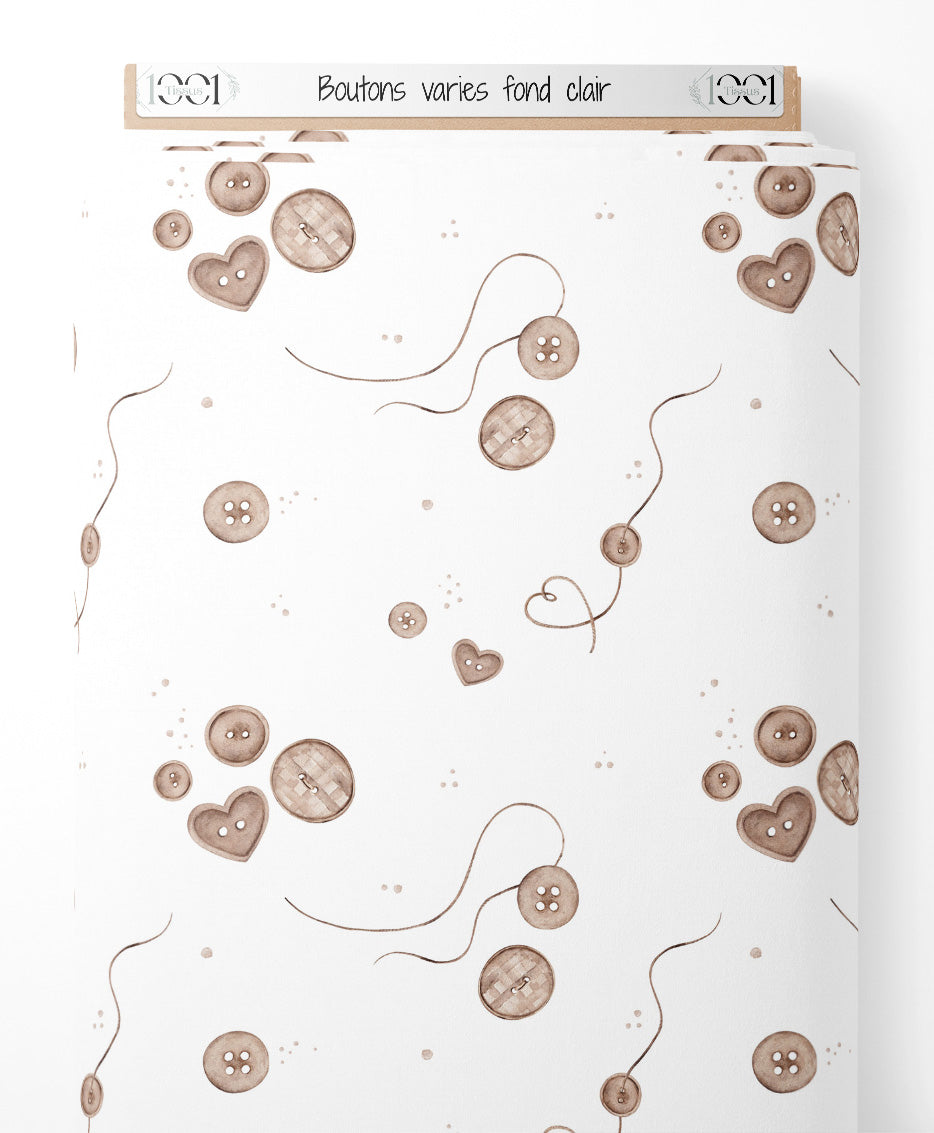 Tissu - Boutons variés sur fond clair
