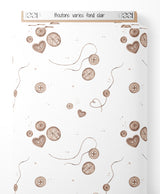 Tissu - Boutons variés sur fond clair