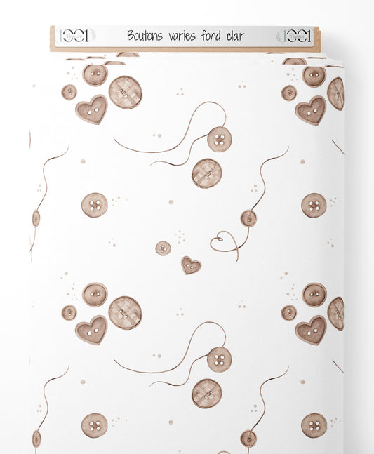 Tissu - Boutons variés sur fond clair