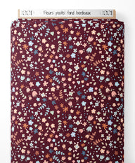 Tissu - Fleurs pastel sur fond bordeaux