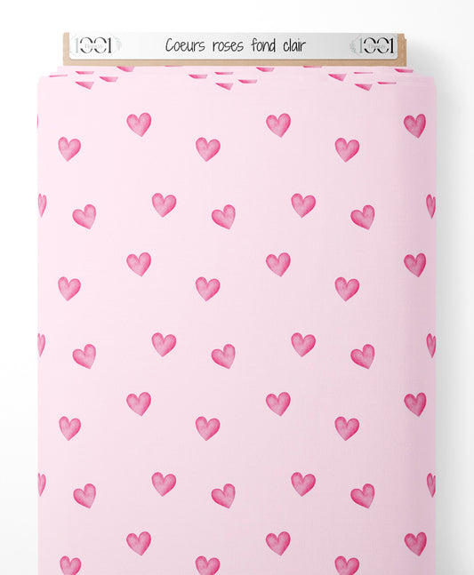 Tissu - Cœurs roses sur fond clair