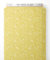 Tissu - Fleurs blanches sur jaune