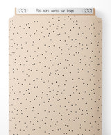 Tissu - Pois noirs variés sur beige