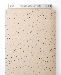 Tissu - Pois noirs variés sur beige