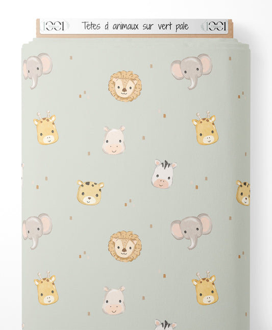Tissu - Têtes d'animaux sur vert pâle