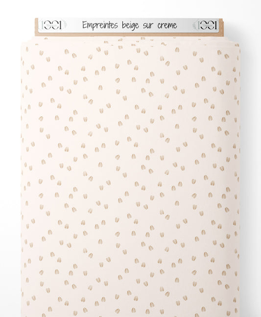 Tissu - Empreintes beige sur crème