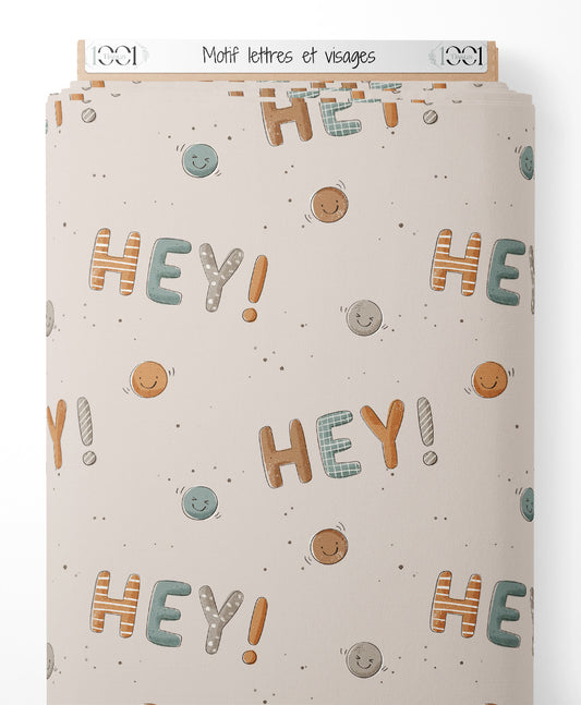 Tissu - Motif lettres et visages