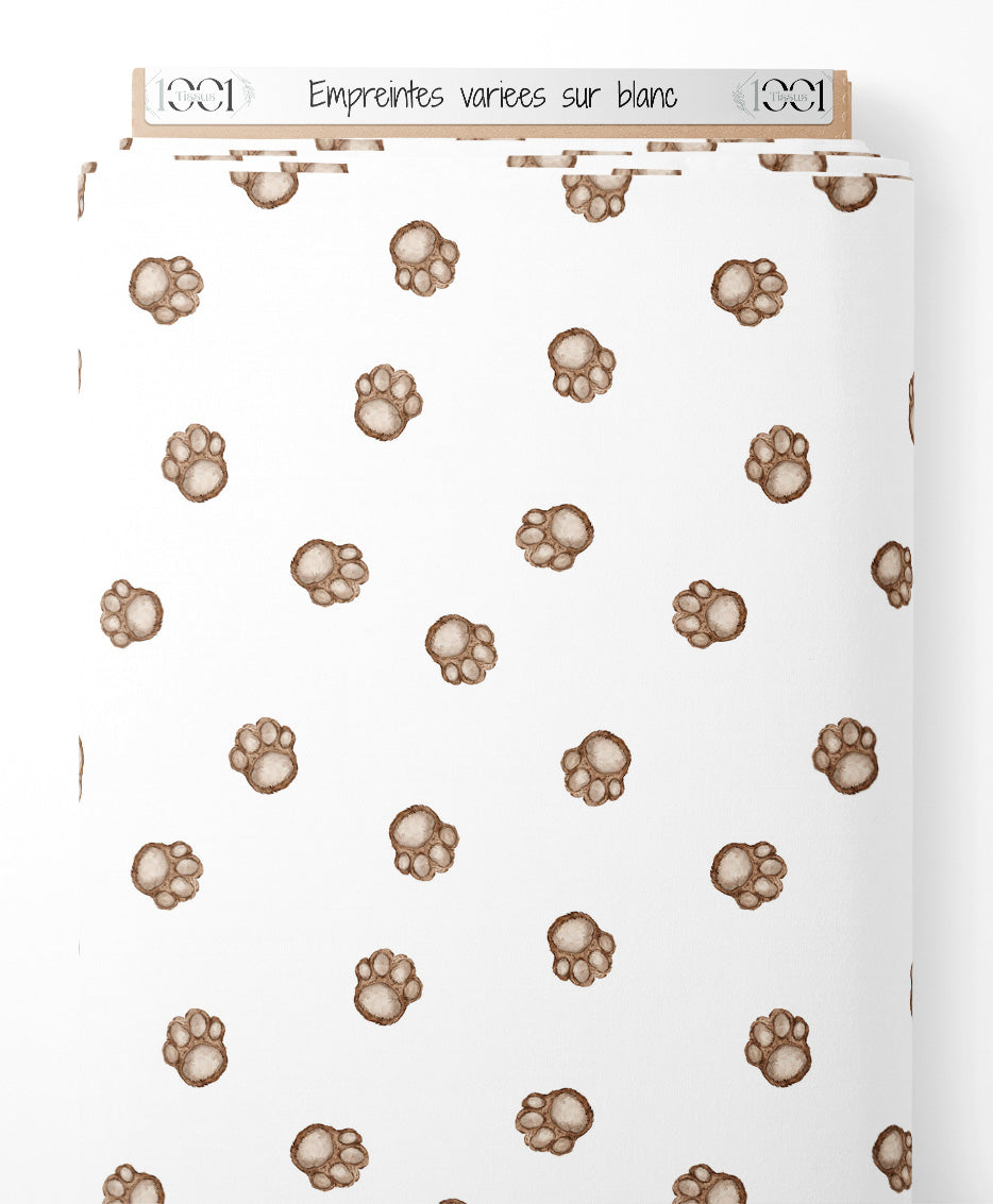 Tissu - Empreintes variées sur blanc