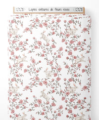 Tissu - Lapins entourés de fleurs roses