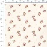 Tissu - Bretzels bruns sur crème