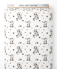 Tissu - Vaches noires sur fond blanc
