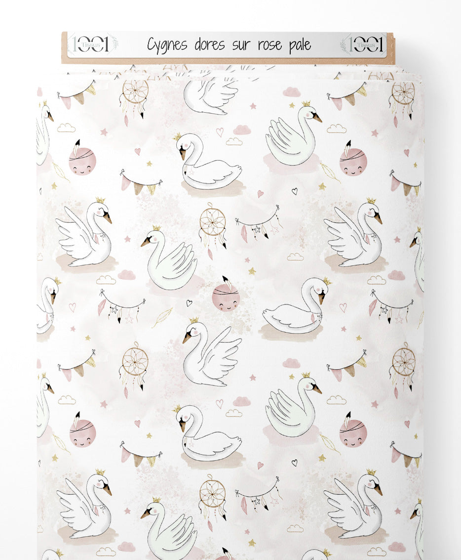 Tissu - Cygnes dorés sur rose pâle