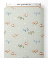 Tissu - Avions pastel sur fond vert