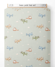 Tissu - Avions pastel sur fond vert