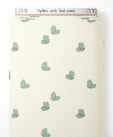 Tissu - Papillons verts sur fond crème