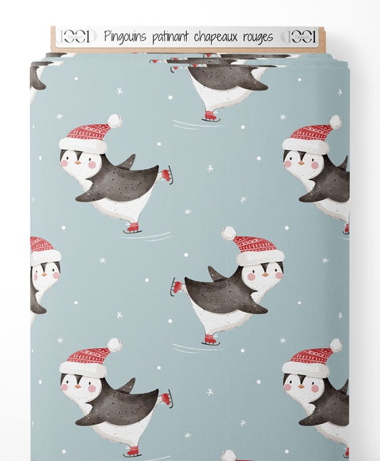 Tissu - Pingouins patinant chapeaux rouges