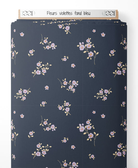 Tissu - Fleurs violettes sur fond bleu
