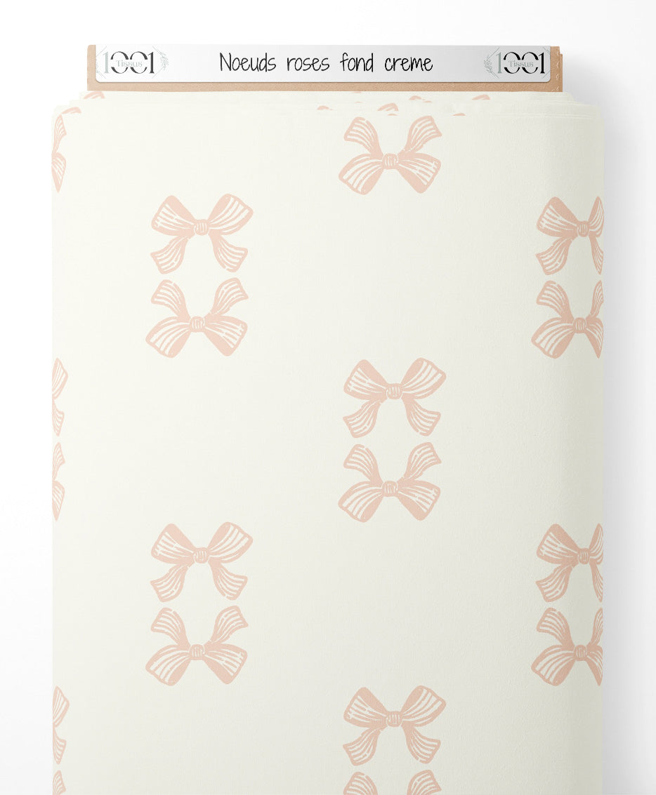 Tissu - Noeuds roses sur fond crème