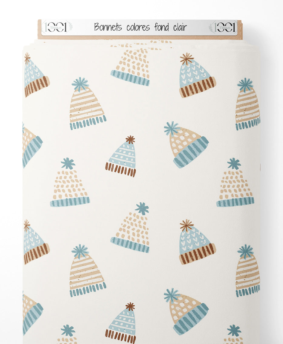 Tissu - Bonnets colorés sur fond clair
