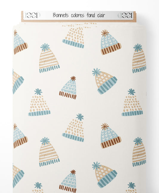 Tissu - Bonnets colorés sur fond clair