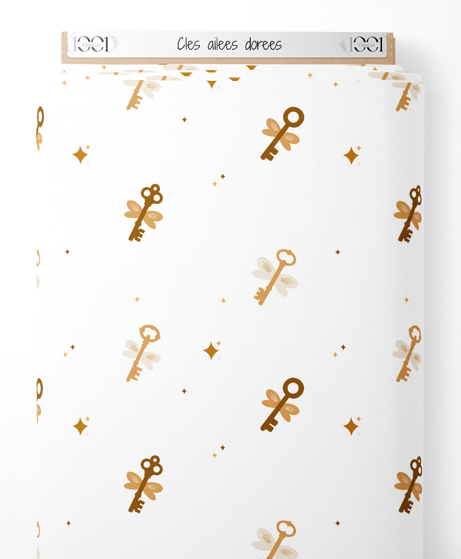 Tissu - Clés ailées dorées