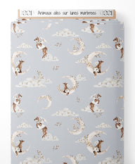 Tissu - Animaux ailés sur lunes marbrées