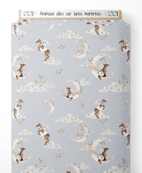 Tissu - Animaux ailés sur lunes marbrées