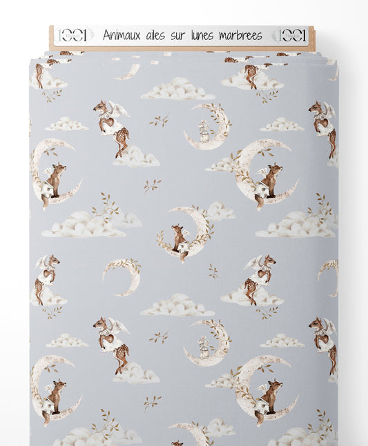 Tissu - Animaux ailés sur lunes marbrées