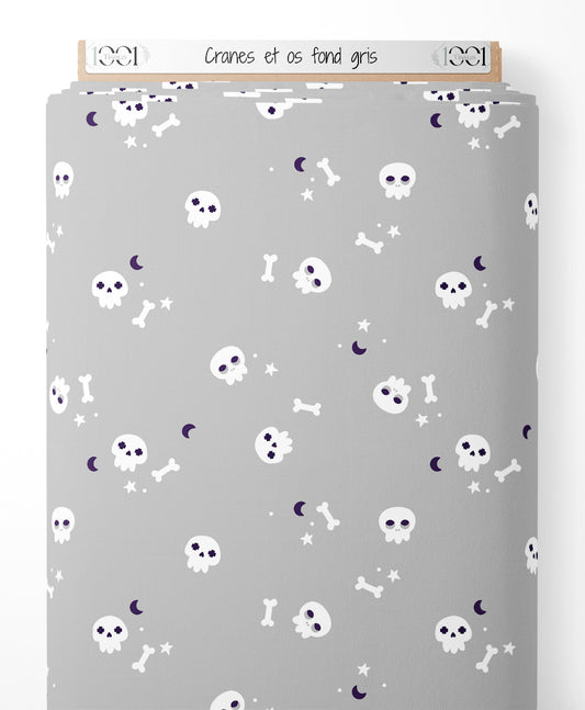 Tissu - Crânes et os sur fond gris