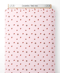 Tissu - Coccinelles sur fond rose
