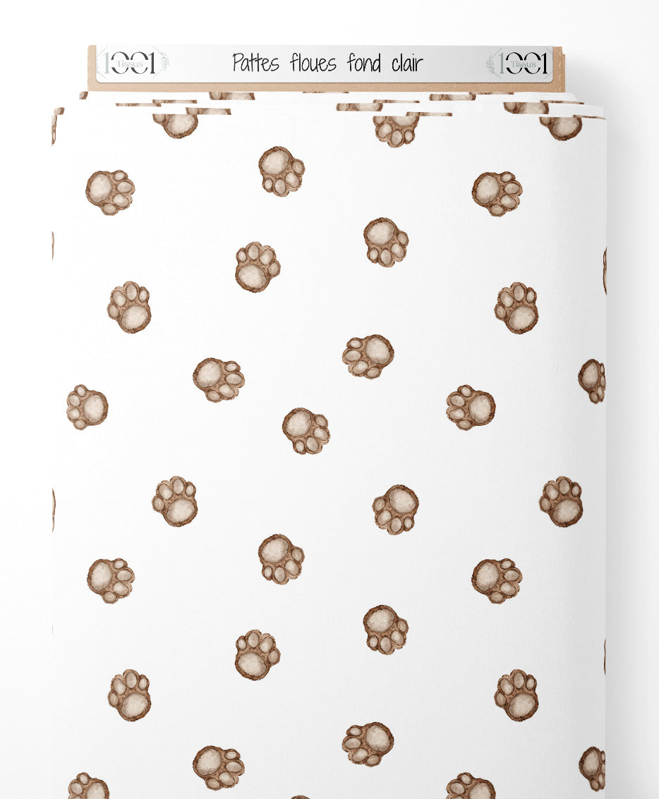 Tissu - Pattes floues sur fond clair