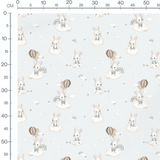 Tissu - Chiens en poses sur bleu doux