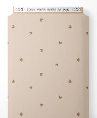 Tissu - Cœurs marron répétés sur beige