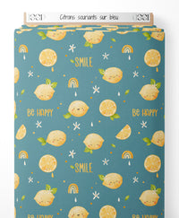 Tissu - Citrons souriants sur bleu