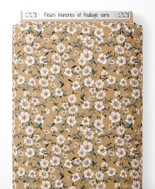 Tissu - Fleurs blanches et feuillage varié