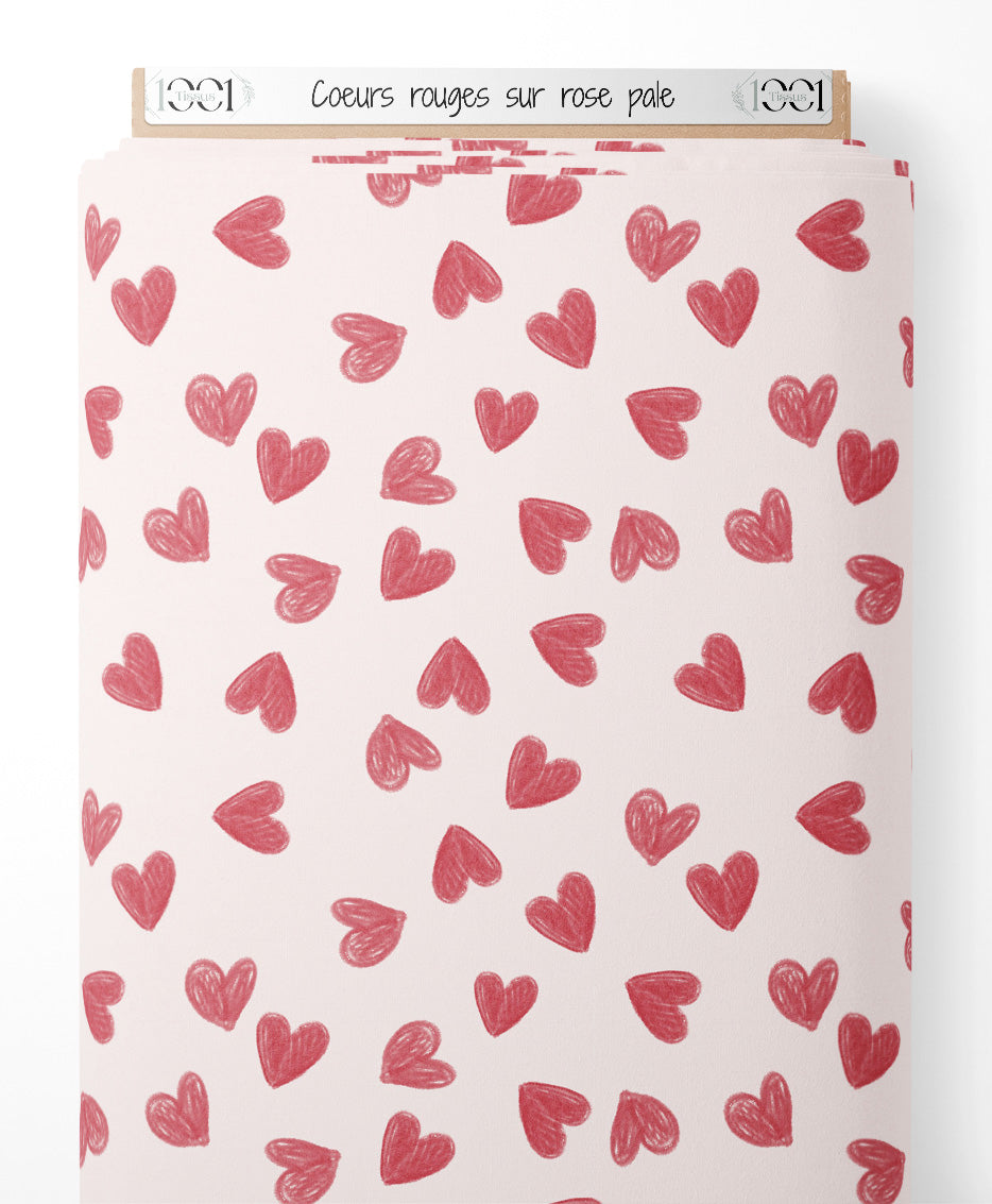 Tissu - Cœurs rouges sur rose pâle